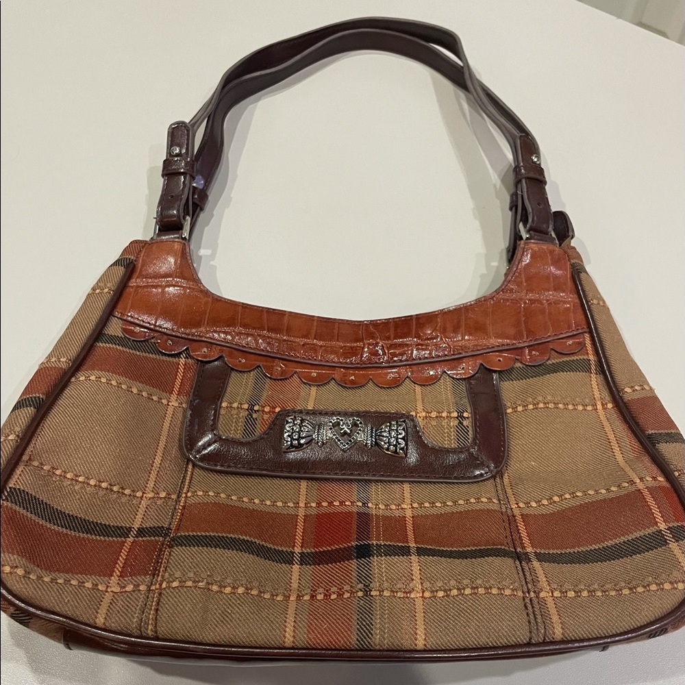 MC Bag  - rust & brown with silver heart hardware.  Has a “Brighton” look…